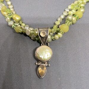 Handmade 3 strand adjustable necklace. Pearls, peridot. Silver clasp.
